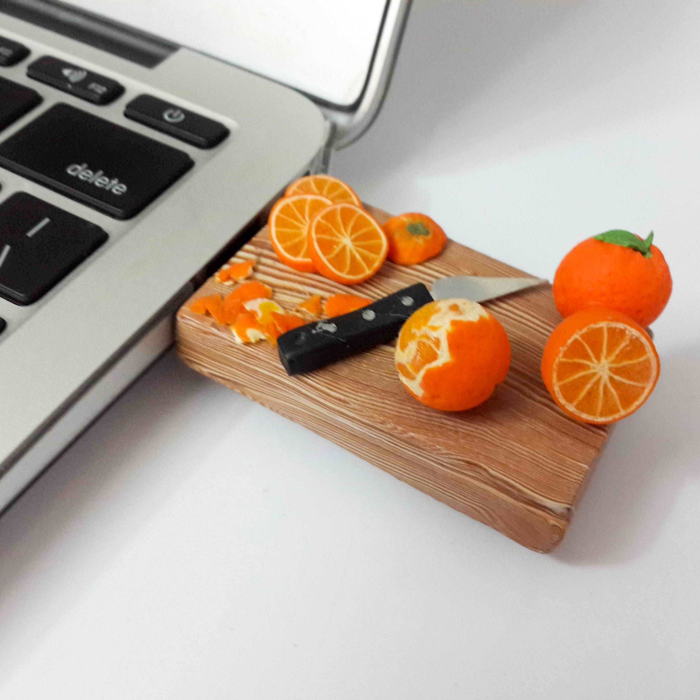 Board Of Miniature Orange Novelty Pen Drive